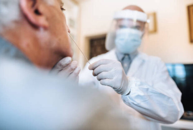 Doctor doing the tampon to research the omicron variant