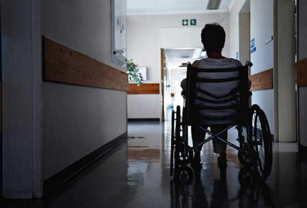 Rearview shot of a senior woman sitting in a wheelchai