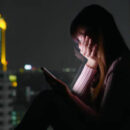 Woman use phone and feel depression at nigh