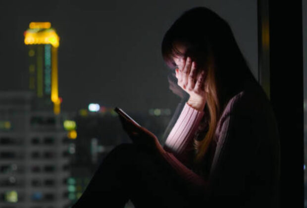 Woman use phone and feel depression at nigh