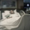 Sick Woman Lying In The Hospital Bed.