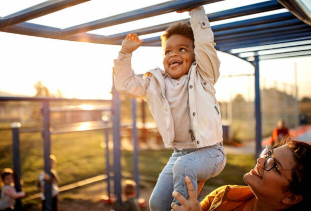 Kid playing with mother in public park