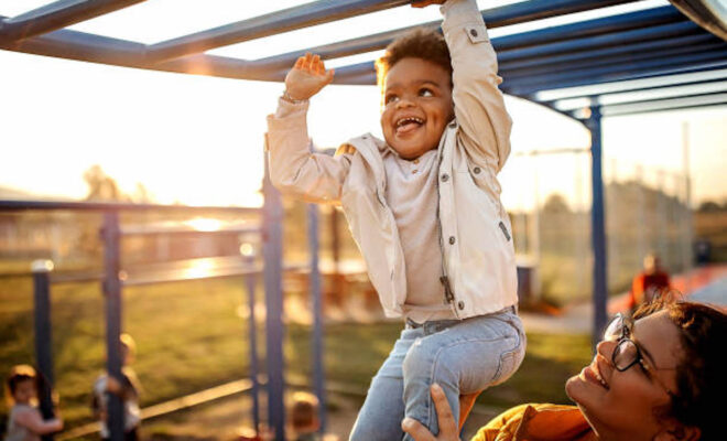 Kid playing with mother in public park