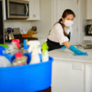 A Professional Housecleaner At Work Cleaning A Home.