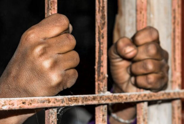Closeup Of Brown Hands Of Prison Inside The Jai