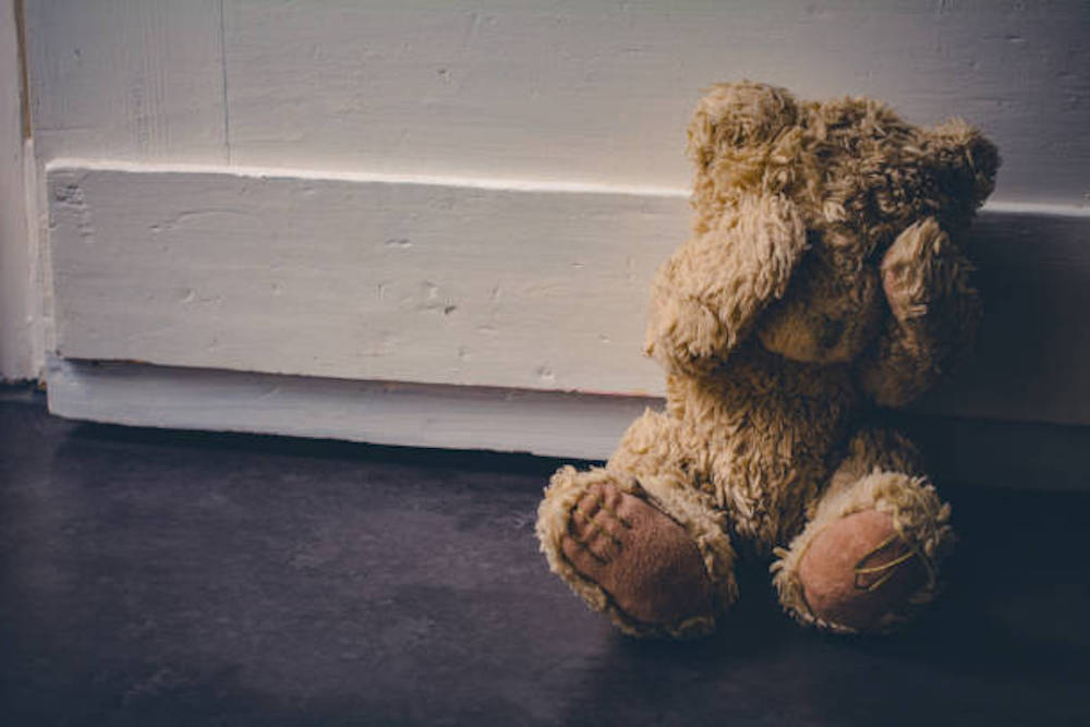 Abandoned Teddy Covering His Eyes, Sitting At Door Child Abuse Concept